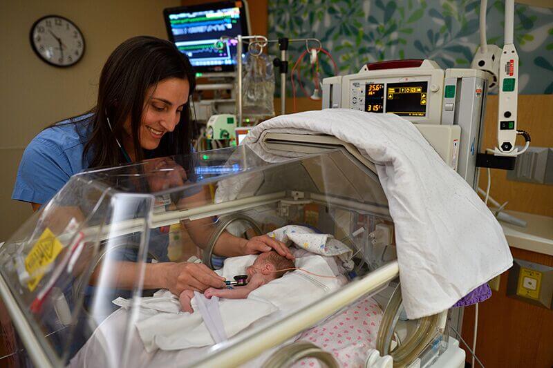 A Nurse With A Baby In The Nicu