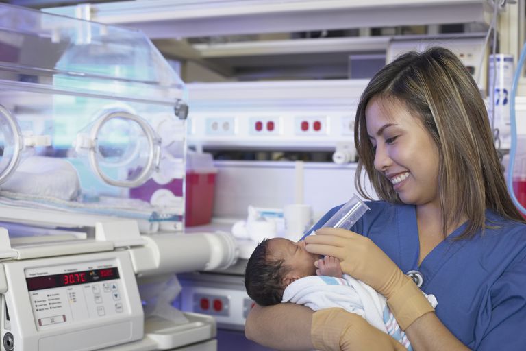 A Baby And Nurse In The Nicu