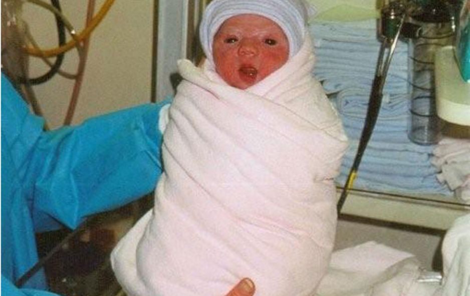 Ashlyn As A Baby Swaddled In Blankets