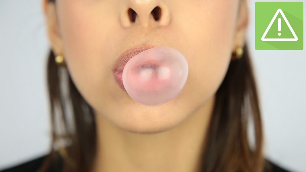 Child Blowing A Bubble With Bubblegum