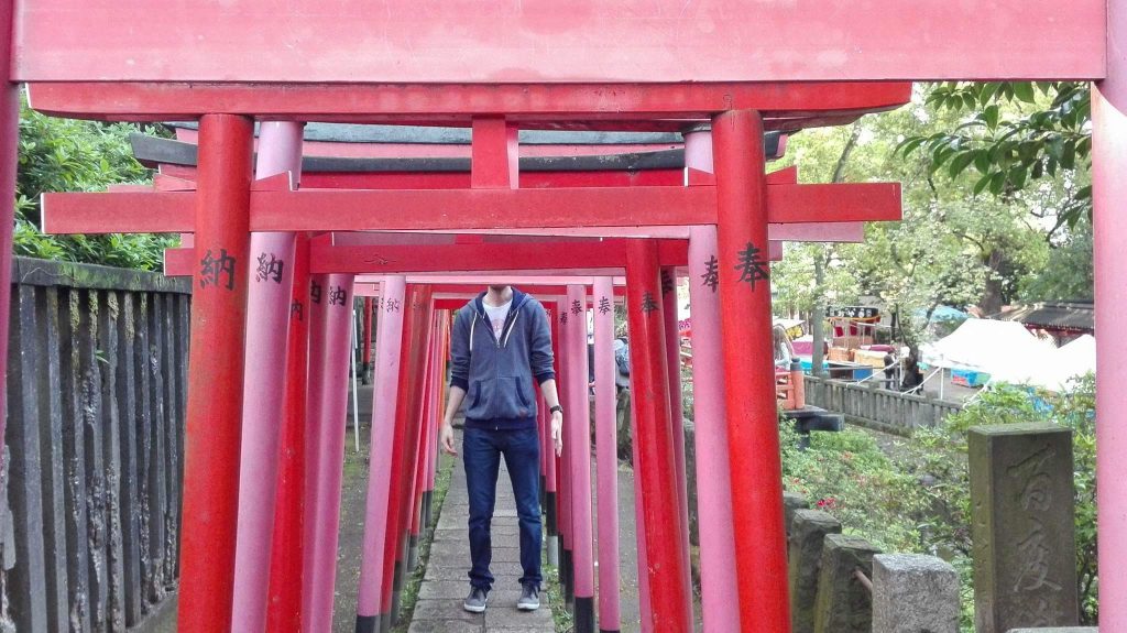 Man at Traditional Japanese Archway