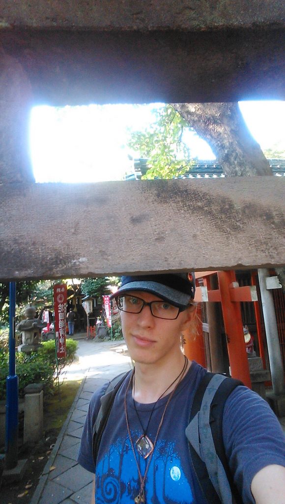 Man Standing Next to Concrete Bridge