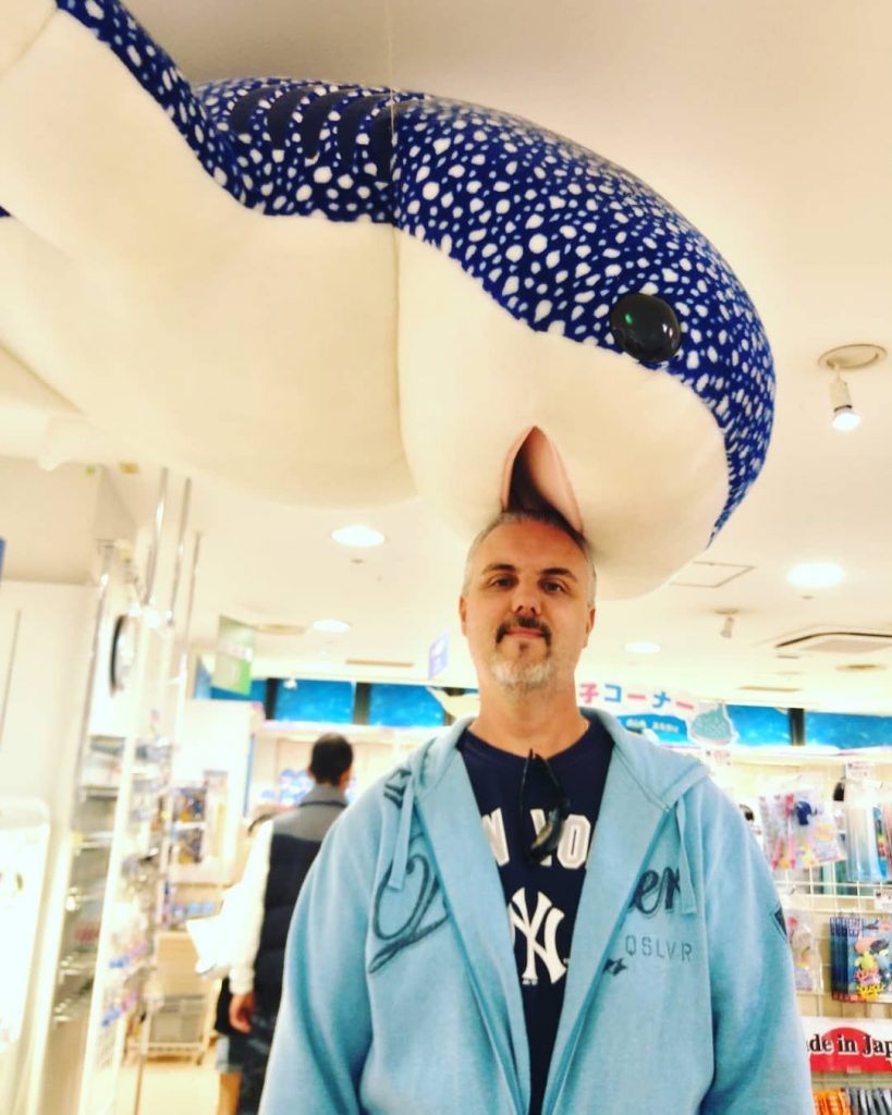 Man with Head in Shark Toy