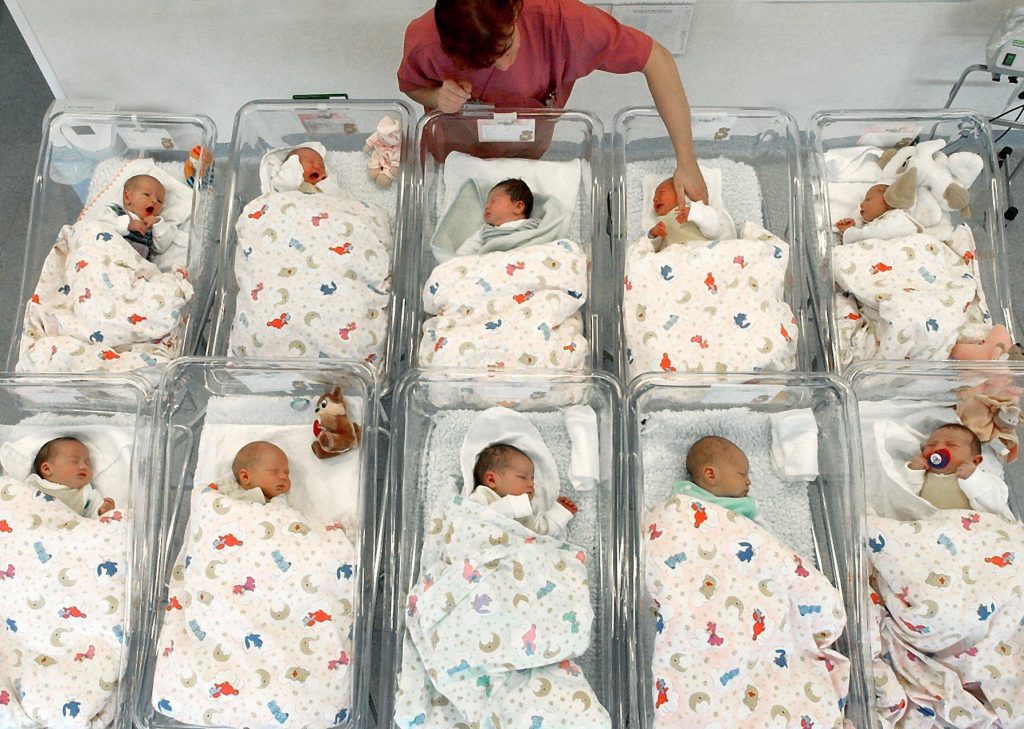 Nurse Checking On Babies