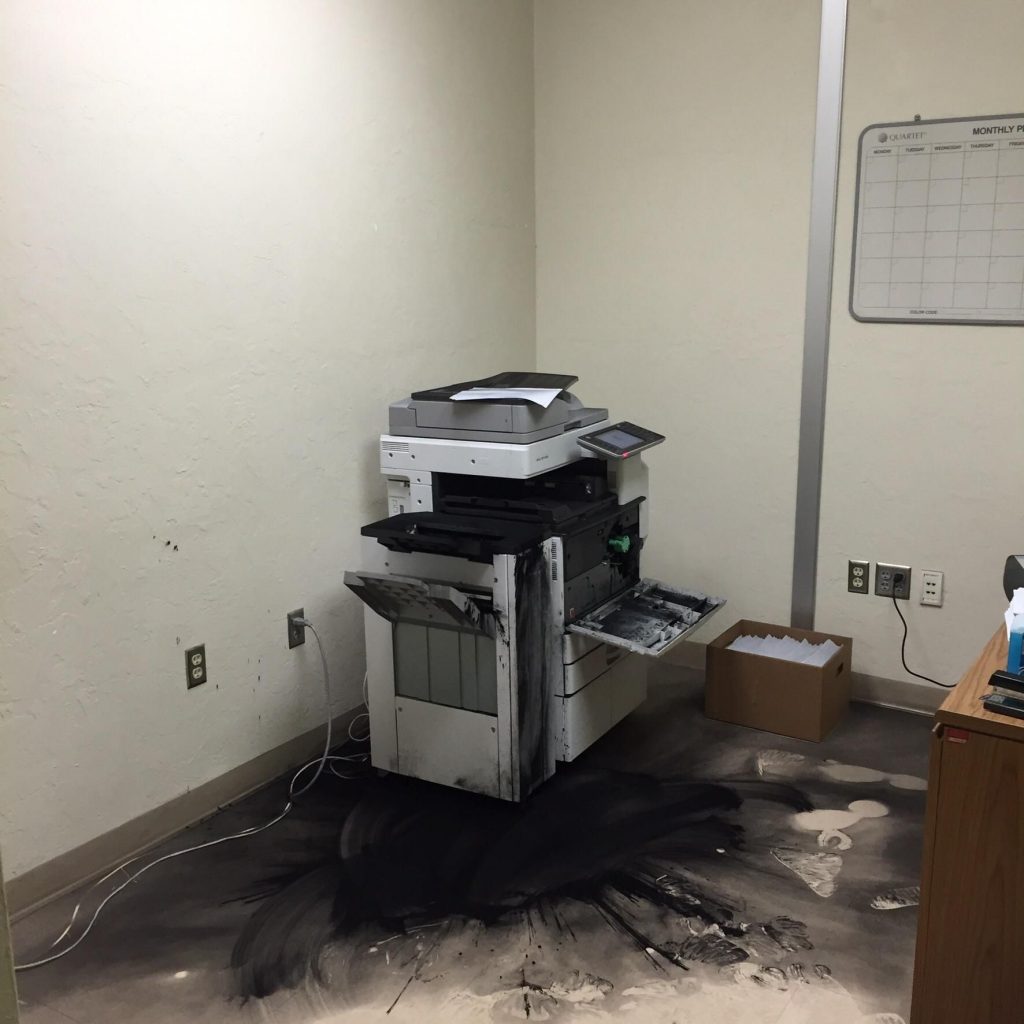 A Printer Surrounded By Toner