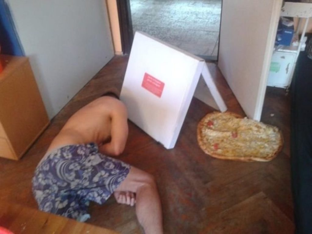 Man With Pizza On The Floor