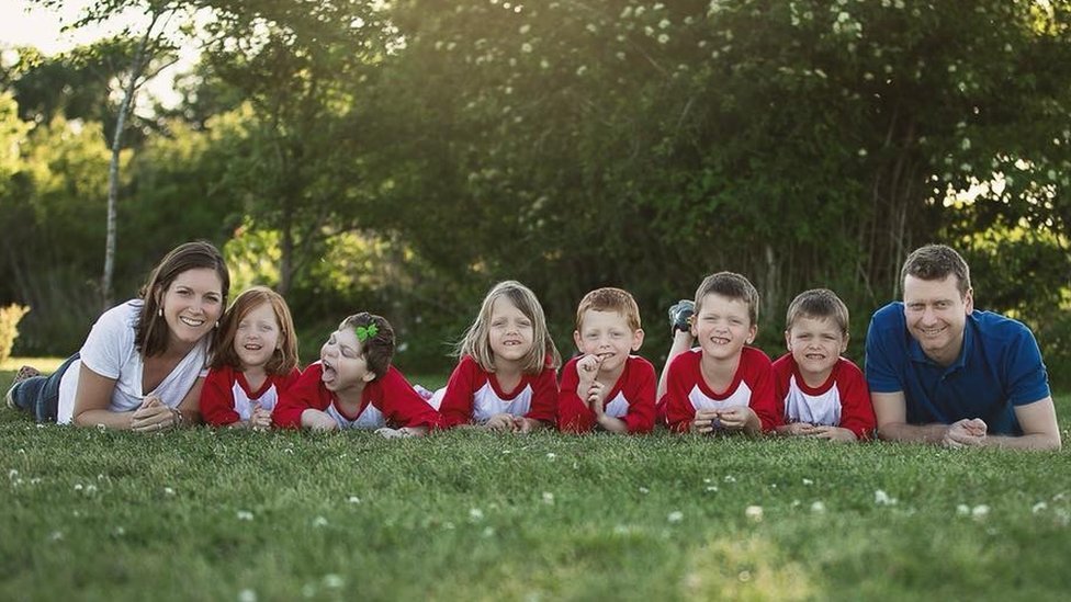 The Perkins Family On The Grass Together