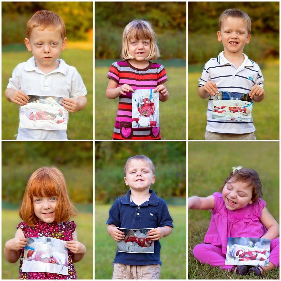 The Perkins Kids Holding Their Baby Photos