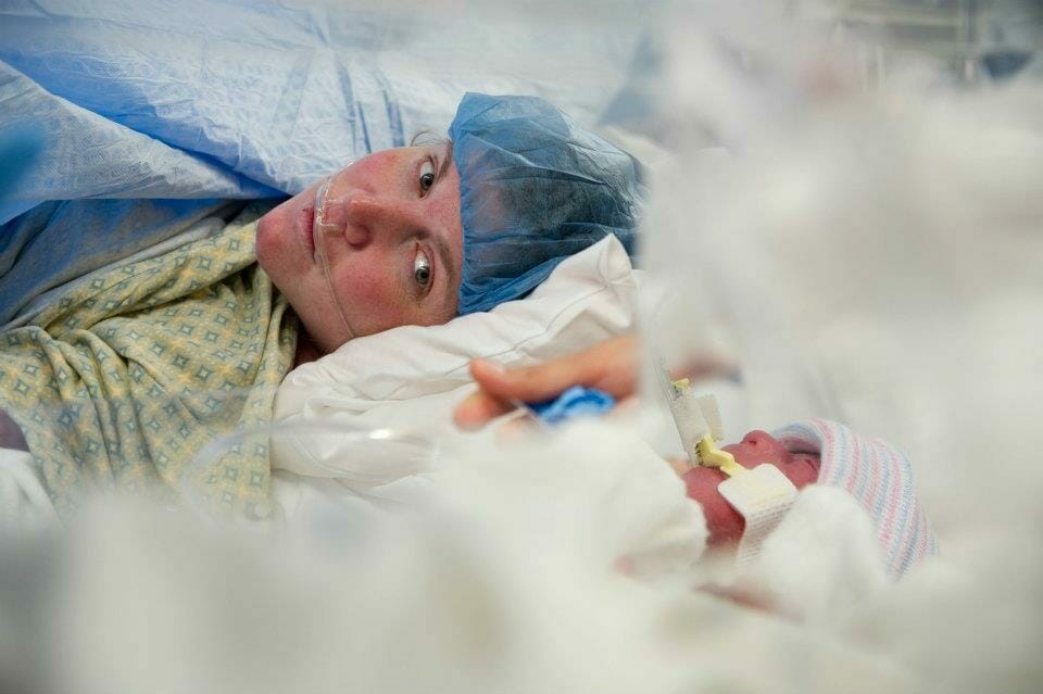 Lauren Perkins Looks Towards One Of Her Newborns