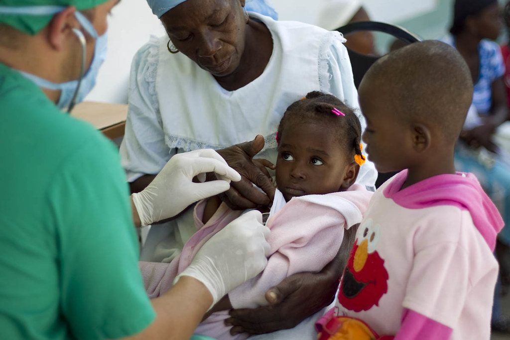 Doctor Checking Haitian Child