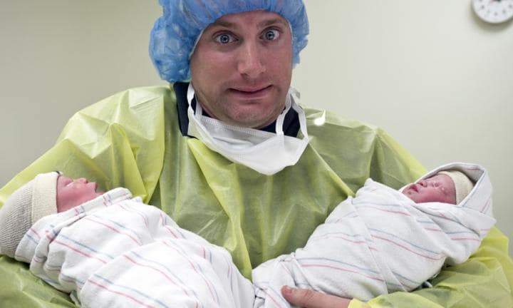 Nurse Holding Two Babies