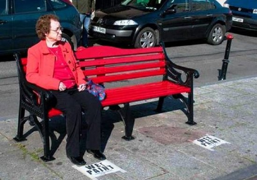 Woman Sitting On Wet Bench