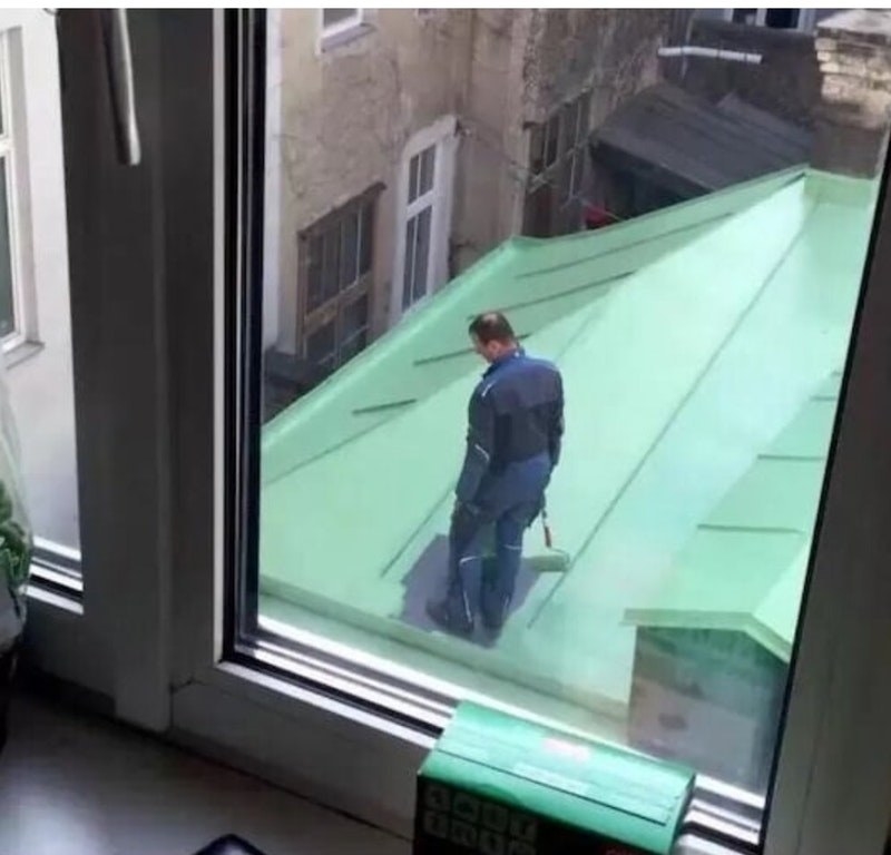 Painter On Roof